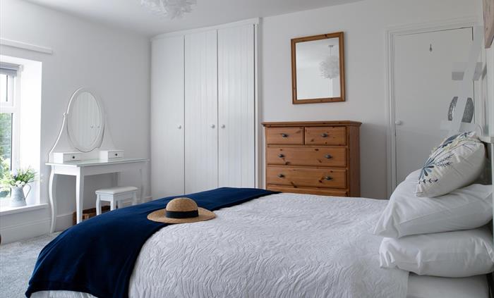 The main bedroom is very spacious.  It has a king-size bed and 2 large windows looking out on a lovely view.  There is plenty of room for the Z bed he